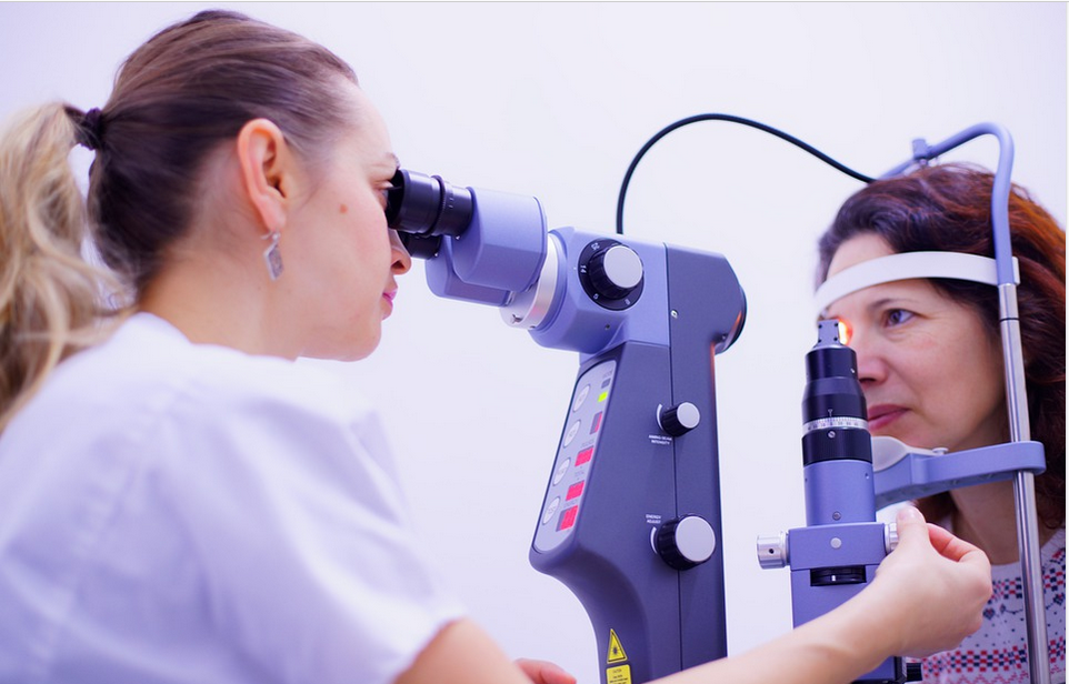 a surgeon examining a patient for cataract